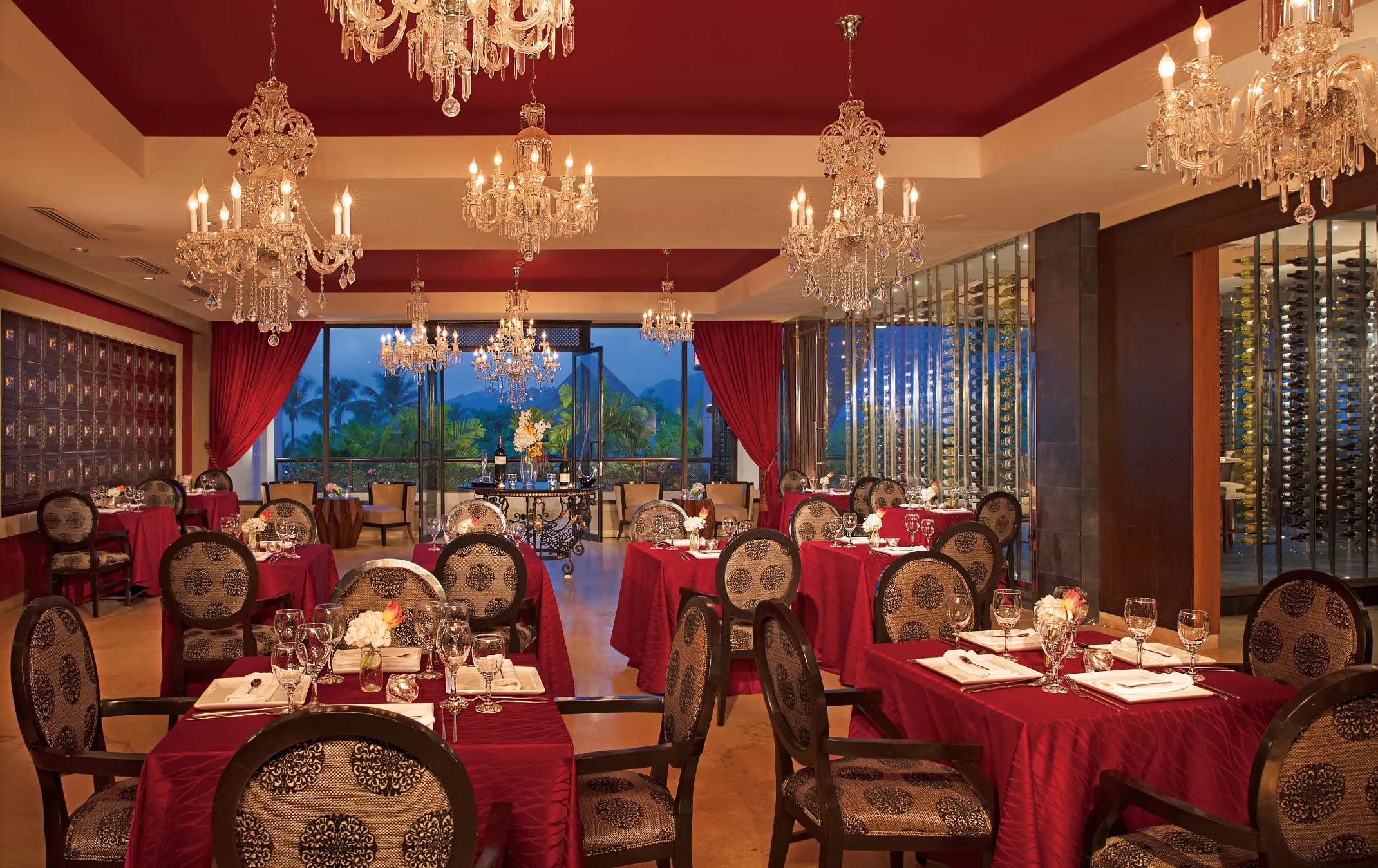 Bordeaux restaurant at Dreams Playa Bonita Panama featuring elegant French dining, crystal chandeliers, and a romantic fine-dining atmosphere.
